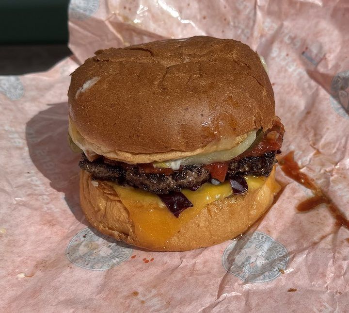A double cheeseburger on butcher paper, from Jason Donnelly's Denmark burger ranking.